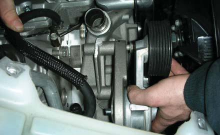 52. In the original tensioner location, mount the modifi ed tensioner standoff with the new tensioner assembly on
