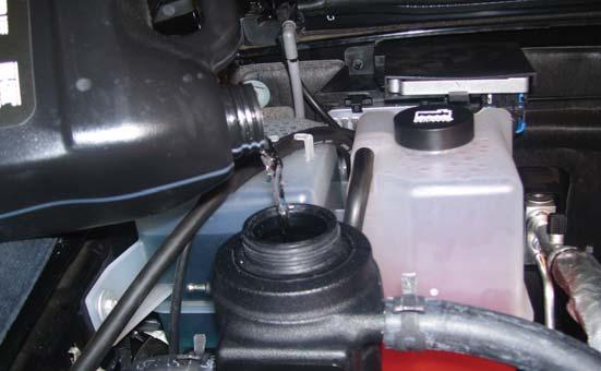Re-fi ll the radiator reservoir and then fi ll the intercooler system with a 50/50 mixture of