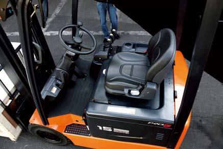 Spacious Operator Compartment Designed for comfort, with enhanced pedal positions, an infinitely adjustable steering column, deck mounted hydraulic levers, and increased foot room