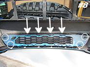 Be sure that all tabs line up and lock into place securely. Now we will remove the upper grille. Take a close look at the way it integrates into the bumper.