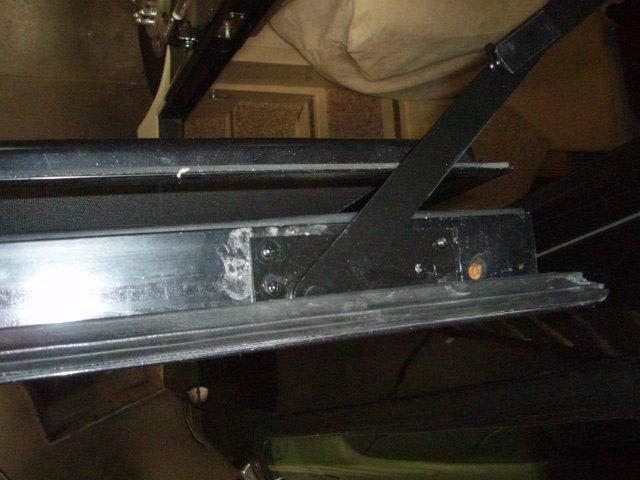 If the frame mounting plate located at the top of the door frame is not in the proper
