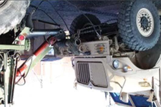 Using ground guides, slowly back the recovery vehicle and connect the retrieval system to the disabled vehicle. If using MUAs, use pin hole number 2.