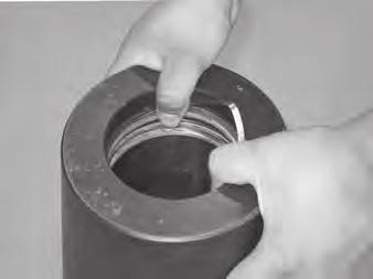 Insert one edge of the seal protector ring into the groove.