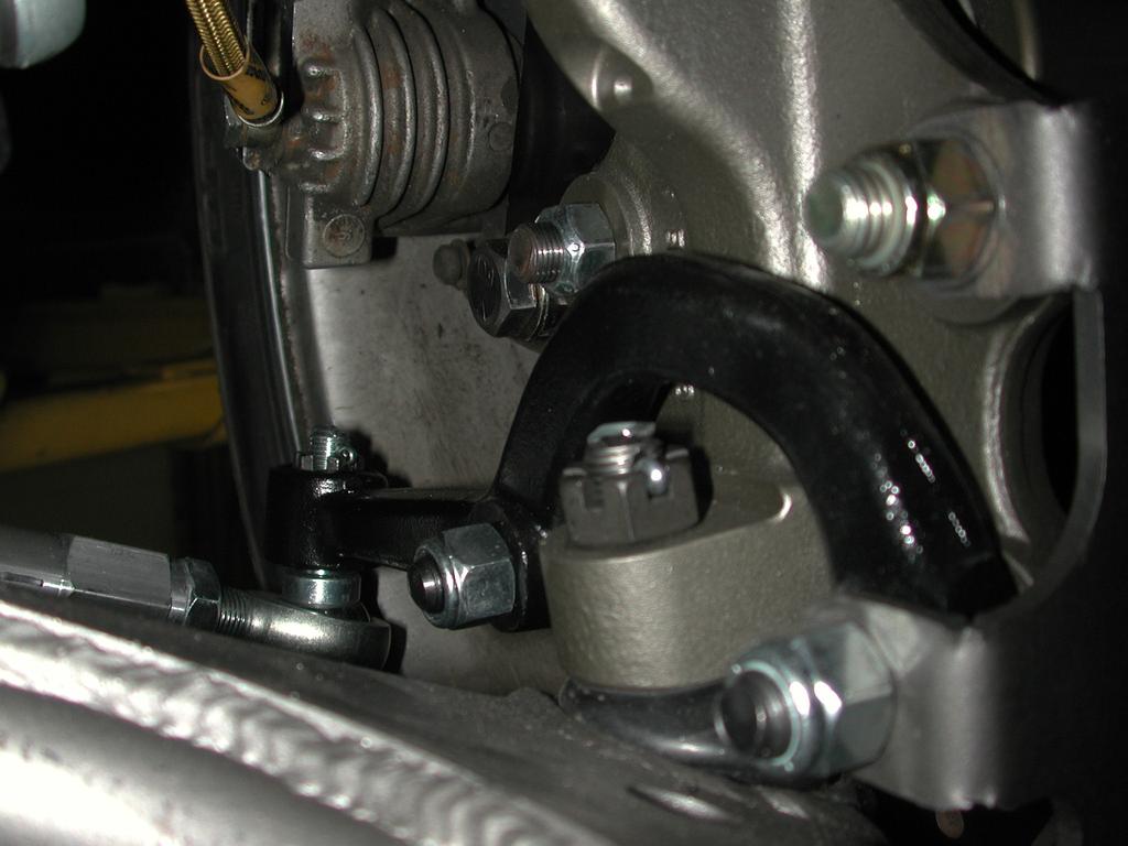 Attach the other end of the lower control arm to the factory frame mount using a ½ x 3 ¼ bolt and Hex nut. 12.