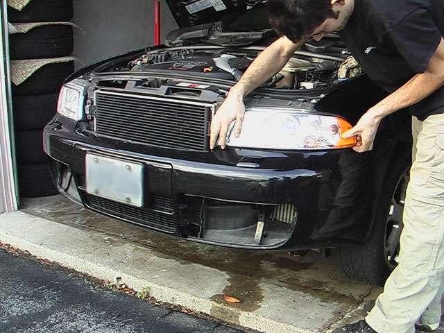 Remove 3 bolts securing each headlight in place.