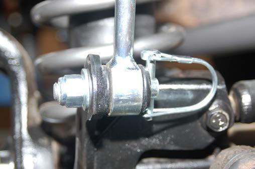 Install the link on the upper sway bar mount as shown in Photo 28. Tighten using a 5/8 & 18mm wrench. 50.