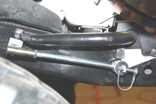 Swing the sway bar link down and install on the lower axle mounting pin. Install the hitch pin. See Photo 31.