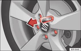 The wheel covers must be removed for access to the wheel bolts. Removing Remove the wheel cover using the wire hook Fig. 71.