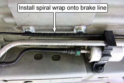 88. (DB ONLY) The outboard brake line will touch the heads of the Door Bar mounting hardware. Wrap the provided spiral wrap onto the brake line where it makes contact with the mounting hardware.
