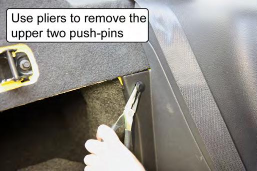 13. (DB ONLY) Remove the two push-pins retaining the