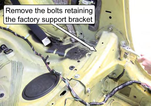 Unbolt and remove the two factory support brackets that connect the B-pillar to the rear seat