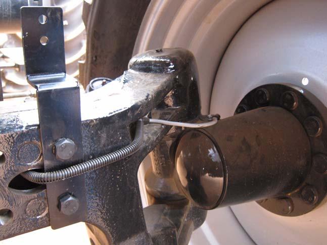 Mounting Wheel Angle Sensor Hardware 2. Attach the Wheel Angle Sensor bracket with the two kit supplied 5/8" x 5 3/4" UNC bolts, washers and nuts. See Figure 3-3. 3. Tighten the bolts using a 15/16 socket, ratchet and wrench.