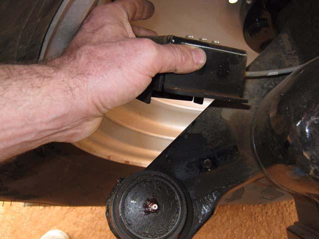 Mounting Wheel Angle Sensor Hardware 6. Completely remove the Accuguide Autosense from the right-hand axle using a 13mm wrench and 13mm socket and ratchet. See Figure 3-5.