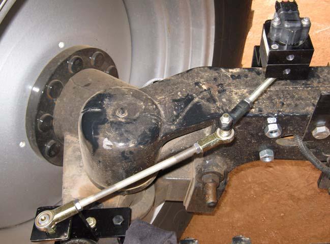 Attaching and Adjusting Wheel Angle Sensor Linkage Rods 11. Disconnect the linkage rods and turn the steering wheel manually to the full left position. 12.