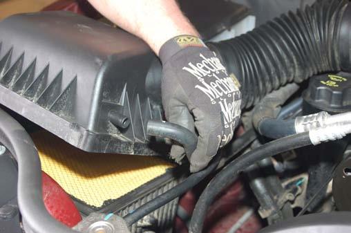 7. Gently lower the floor jack under the front driver side and place it under the passenger side lower