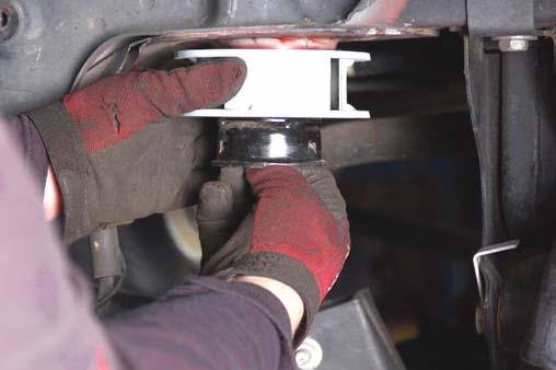 9. Install the bump stop bracket on the new spacer as shown with supplied 10m