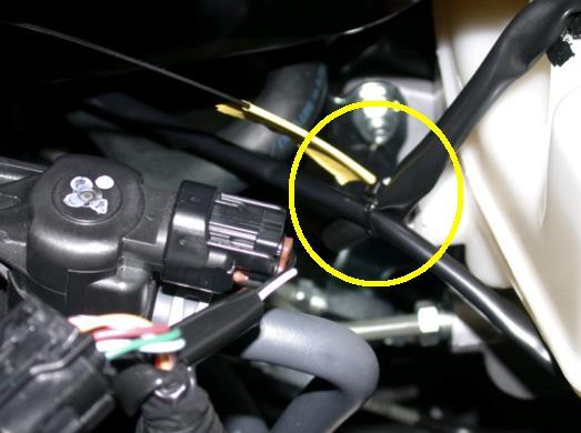 reservoir Picture 1B: wire tie to the harness just below the driver s side headlight 2.