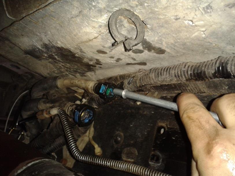 Install the fuel return line bypass tube into the two 3/8 quick connect