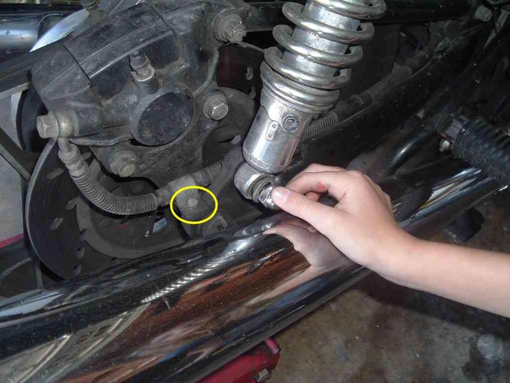 You may have to use an open end wrench to loosen the lower shock bolt to allow enough wiggle room for removing the top shock mount.