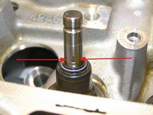 Fig. 2: View Of Nicked Valve Stem (2 Of 2) Courtesy of GENERAL MOTORS CORP. A valve stem nick can be in any 360 degree area due to rotation, so each valve stem must be examined carefully.