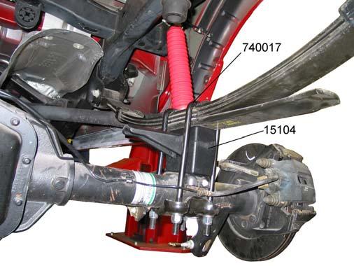 3) Loosen the U-bolt nuts on both sides of the vehicle. 4) Remove the passenger side U-bolts only. Carefully lower the rear axle and remove the original riser block.
