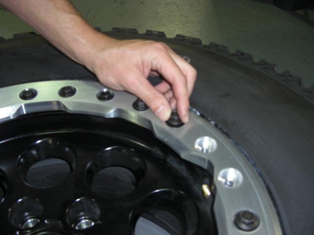 STEP 6: Hand-tighten all remaining bolts on the bead-lock ring. Ensure the gap between the ring and wheel is uniform around the entire circumference.