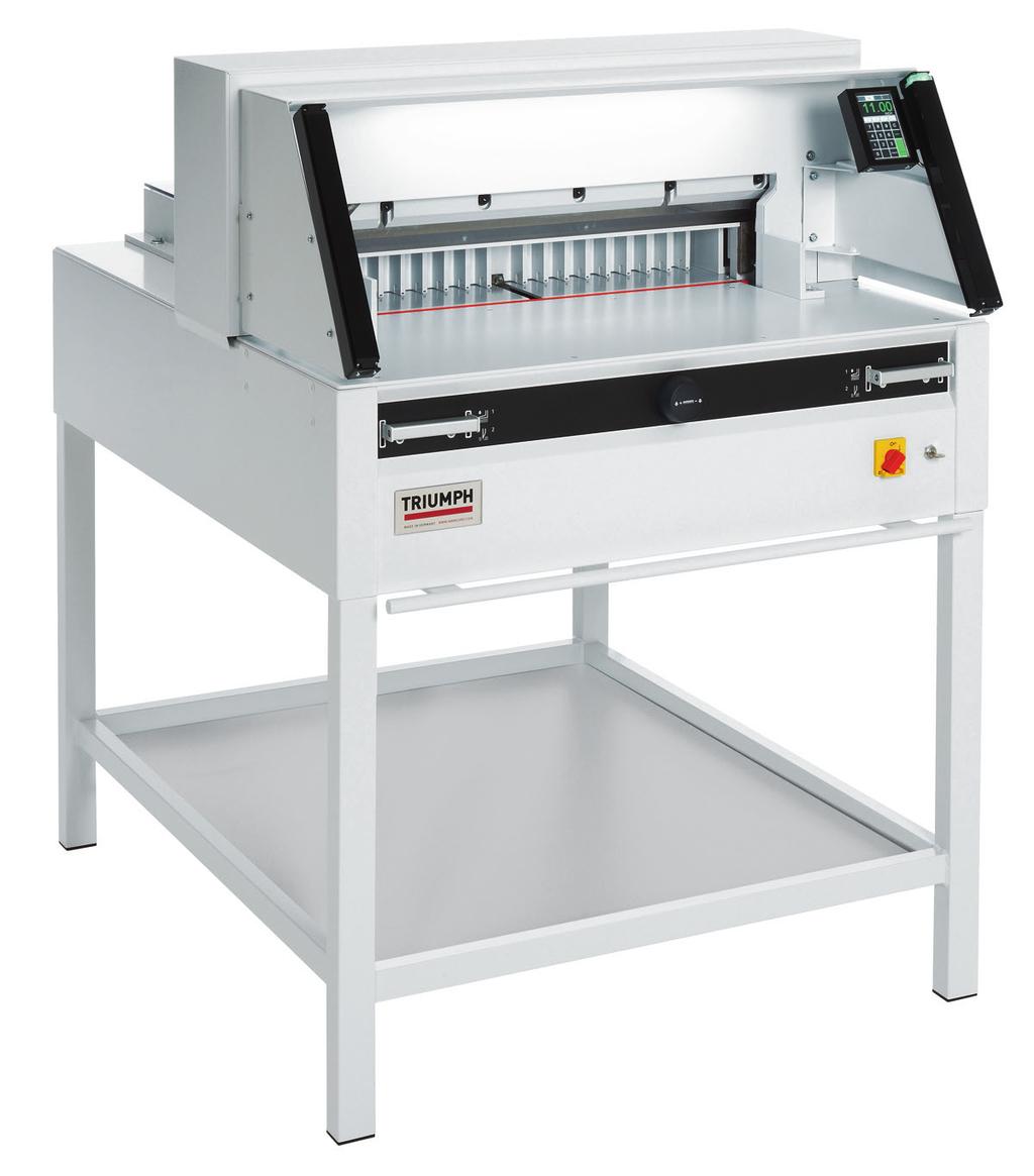 TRIUMPH 5260 Programmable cutter with automatic clamp, power back gauge, digital touchpad, and IR safety curtain on front table. Bright, LED optical cutting line.
