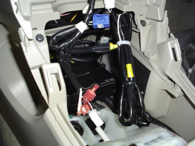 Bulk of harness will reside towards front of center console assembly. c. Route LED module connector forward and behind kick panels. d.