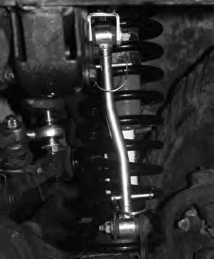 Place a jack under transfer case crossmember and remove the 4 screws that mount the transfer case pivot assembly from the body of vehicle (it will be necessary to roll floor