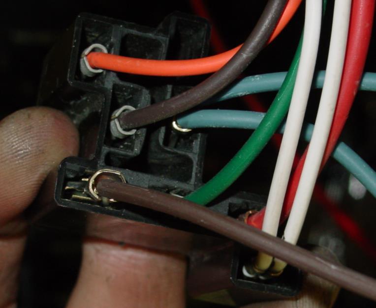 3. Now, locate the blue and brown wires on the supplied module pigtail. Slide the blue wire/female terminal into the cavity in the headlight switch connector where you removed the stock blue wire.