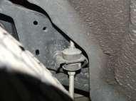 Carefully lower the floor jack, until suspension is fully dropped down. 11. Remove rear coil springs. 12.