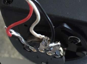 Picture on left shows short between white and black wire. There could be a short between the white control wire on the Sabertooth and either the black or red wire on the Sabertooth.