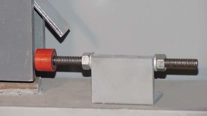 FIGURE 11 12. In the open position, the Stop Assembly must be placed 1/8 away with the bumper centered directly on the front bar at the rear of the travelbar assembly.