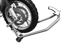 When raising the motorcycle, make sure that the center stand remains on the ground. Apply uniform pressure to push front wheel stand down and raise motorcycle.