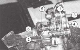 Adjust the braking system and check for correct operation The shim washer (1) must not be tilted between the handbrake lever and the housing.