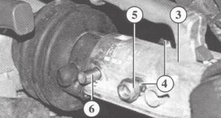 self-locking nuts (5) and tighten to 86 Nm When inserting the rear attachment bolt, the damper eye retaining