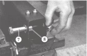 Loosen and remove the nut of the damper mounting bolt Pull out the damper mounting bolt (7) and