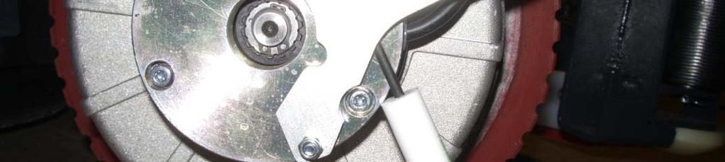 The brake can be disengaged by putting a wedge or a small screwdriver (shown) or coin behind
