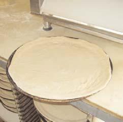 Once you have pre-portioned & floured your doughballs, place a small amount of flour in the hopper and on the receiving table.