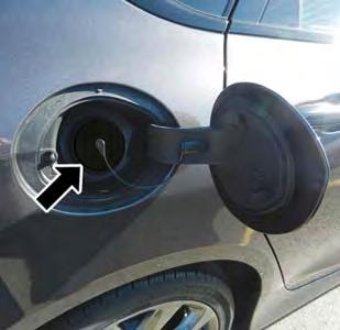 MAINTAINING YOUR VEHICLE 3. Remove the fuel filler cap (gas cap) and hang by tether hook on fuel filler door.