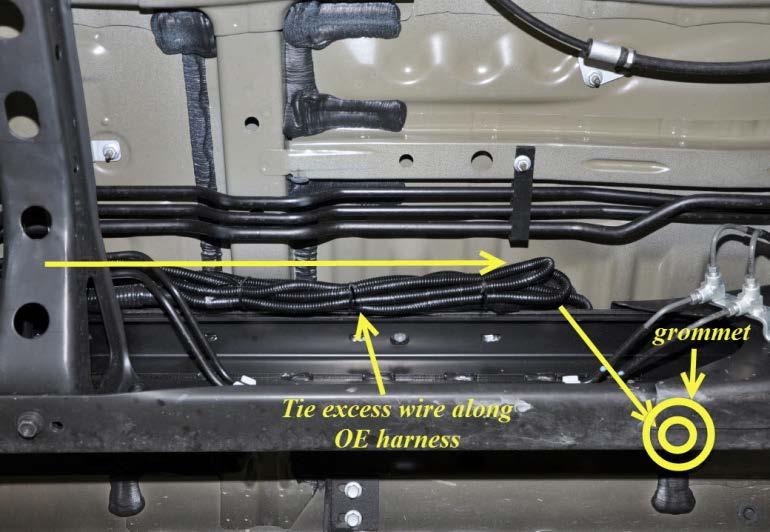 e) Secure excess bed light LED wire harness to OE Factory wire harnesses using wire ties in the location near the rear of the grommet (as illustrated). (Fig. 3-12) (Fig.