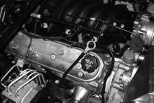 2. IGNITION COIL RELOCATION A. Locate the coils and their bracket on the passenger side of the vehicle. B.