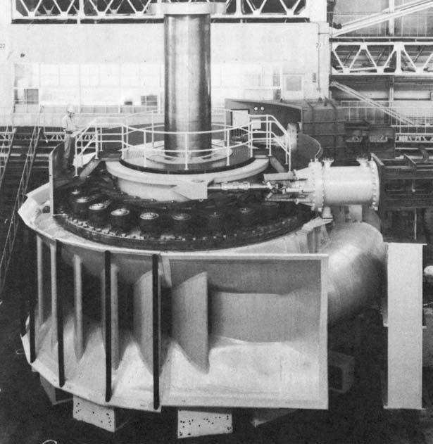 Figure 13.5 Assembly of Francis turbine (servomotor at top right). two hydraulic servomotors (Figure 13.5), or by individual servomotors (Figure 13.6).
