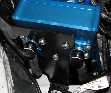 34) You ll want to hook up the OEM hose that we unhooked in step 29 (colored in blue) to the open barb on the throttle body. This completes the coolant hook ups.