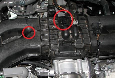 To remove the cover that typically goes on top of the manifold, push rearward on the