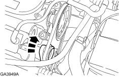 Rotate the belt tensioner clockwise to relieve tension on the drive belt. 35.