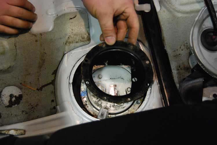 11. Remove the sending unit, hold it in place and allow excess fuel to drain.