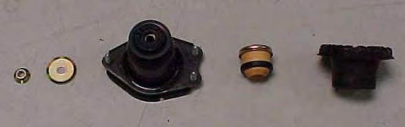 15) Carefully decompress the stock spring and remove it from the shock assembly.