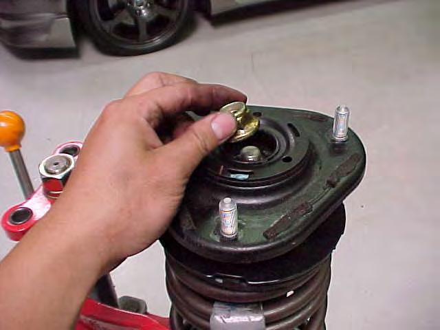 20) Reinstall the strut assembly into the vehicle in