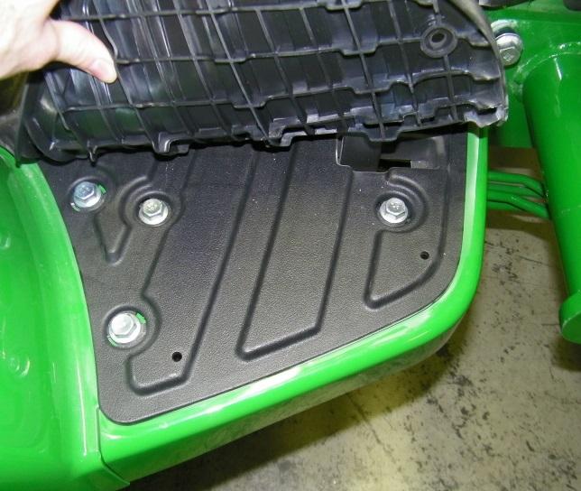 Make a note of how the wires are connected behind the seat, disconnect wires, and pull out of the ROPS tube (Roll-Over Protective